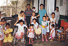 Photo of several orphanage children with gifts