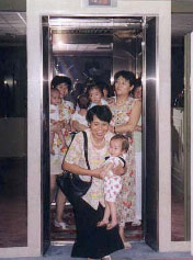 Orphanage workers carrying in the babies.