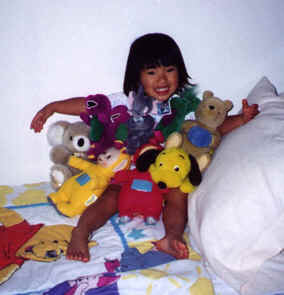 Katie and her stuffed animal friends.